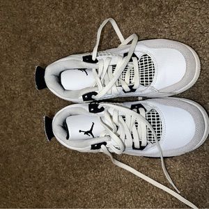 Gray, black, and white boys basketball sneakers.